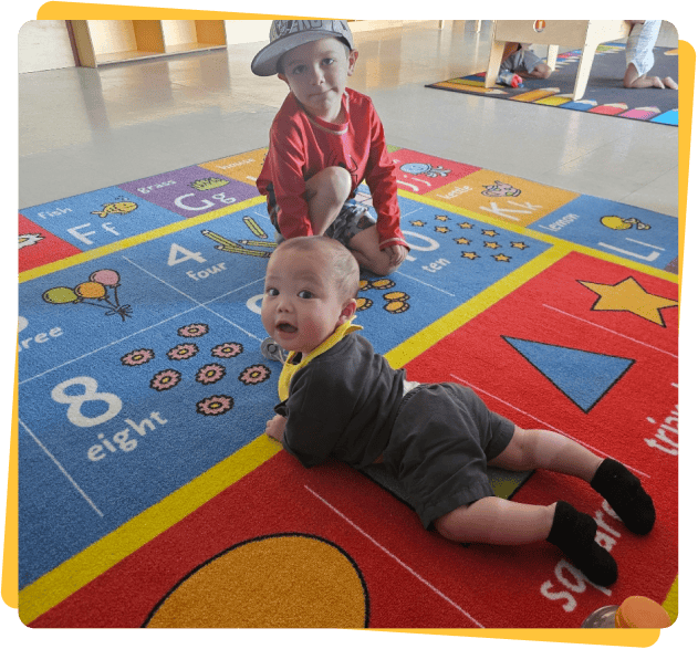 infant playing with blocks